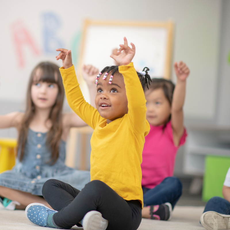 children learning body parts through movement in SEN EYFS classroom