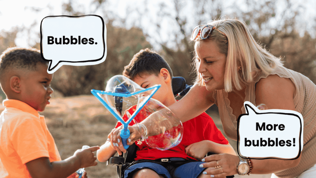 Adult modelling simple language during a bubble activity with autistic children, using “Bubbles” and “More bubbles.”