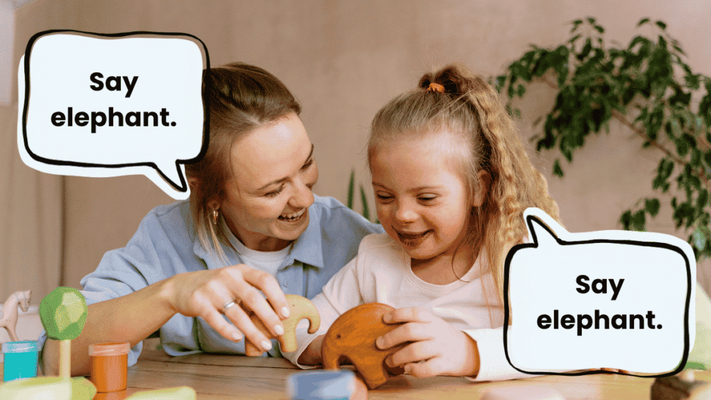 Adult prompting an autistic child with down syndrome to say “elephant” during a play activity, illustrating pressured language modelling.