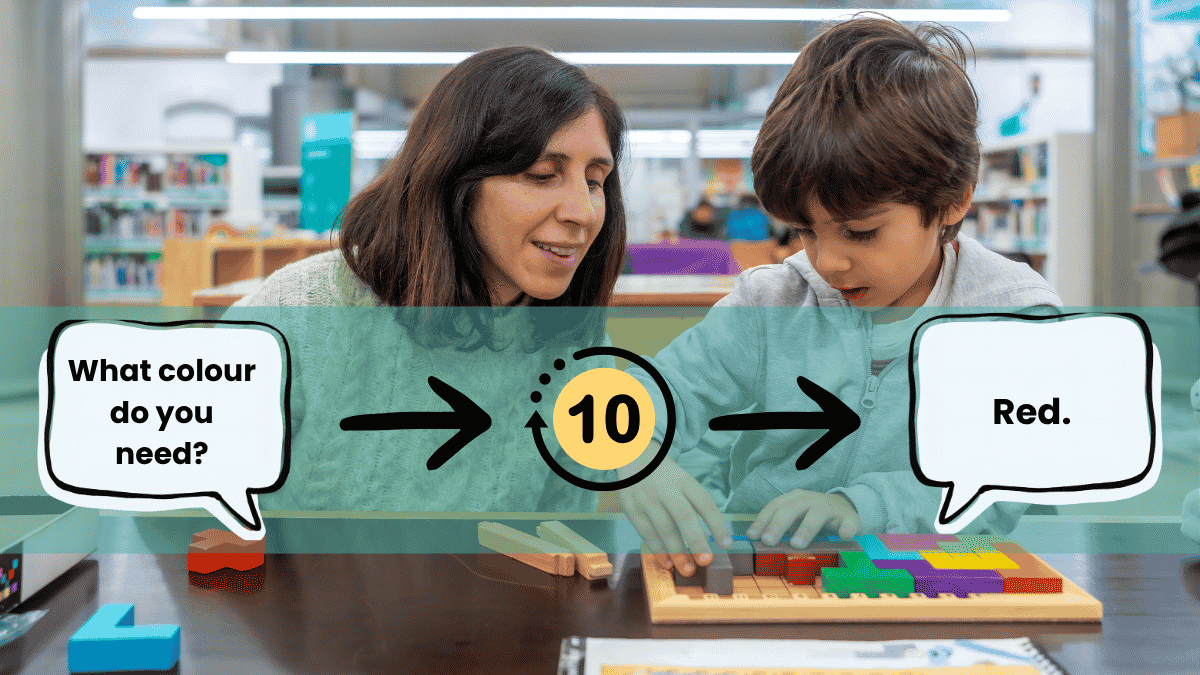 Teacher giving an autistic learner processing time to respond to a question during a classroom activity.